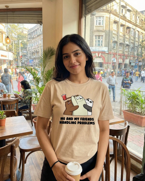Woman wearing a t-shirt with a graphic design in a cafe